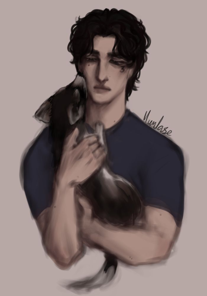 Jean Moreau holding Jabberwocky, a midsized dog with black, white and brown colouring.