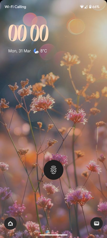 A screenshot of my phone lockscreen. The background is pinky flowers with the sunshine peeking through 