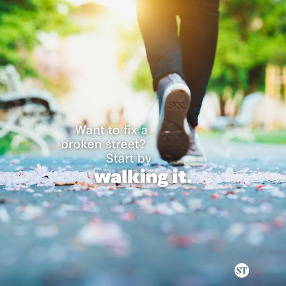 Photograph of feet walking on a street. Text says “Want to fix a broken street? Start by walking it.”