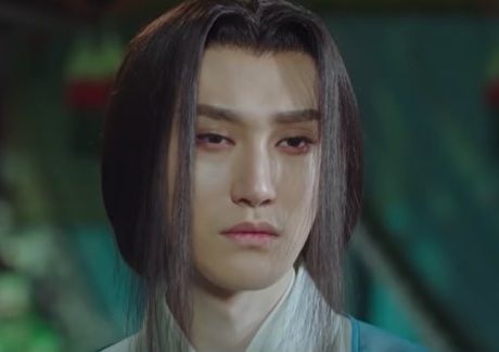 screencap of the actor wang duo from the historical fantasy drama bloody romance; his expression is sad and angry