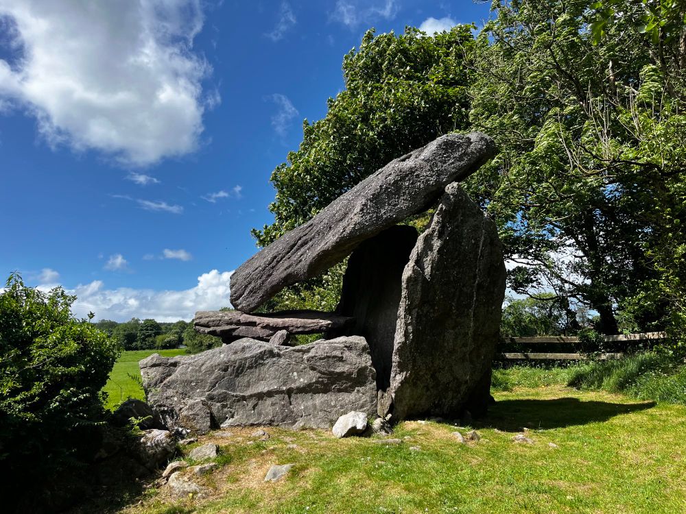 Leac an Scáil dolmen. A very tall portal tomb with a steeply inclined capstone. 