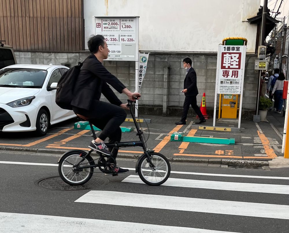 Younger man on a folding bike