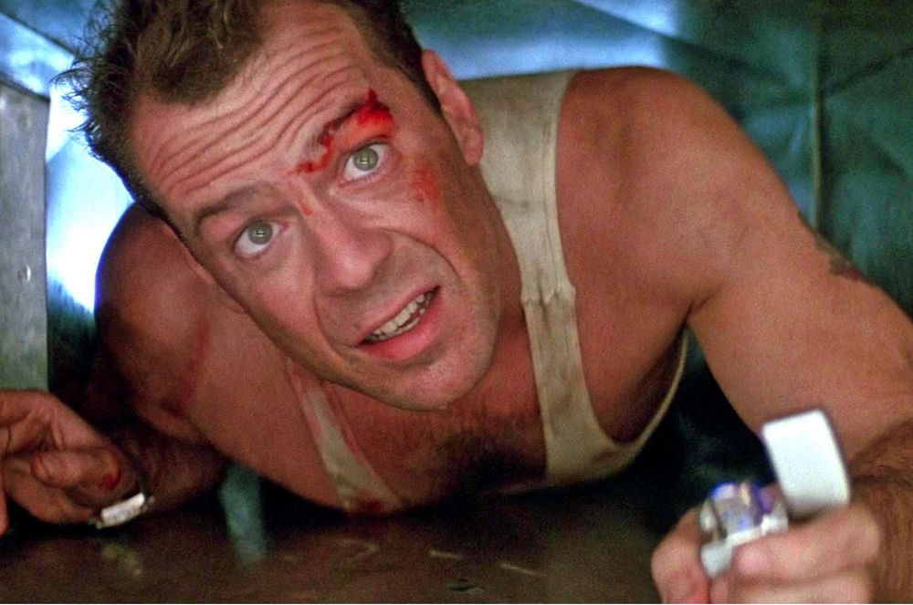 Bruce Willis as John McClane in “Die Hard” trying to save his ex-wife held hostage. 