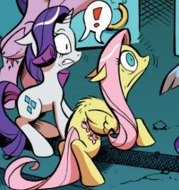 A screenshot of the My Little Pony: Friendship Is Magic comic zoomed in on a panel of Rarity and Fluttershy being surprised. Fluttershy notably has her hackles raised like a cat.