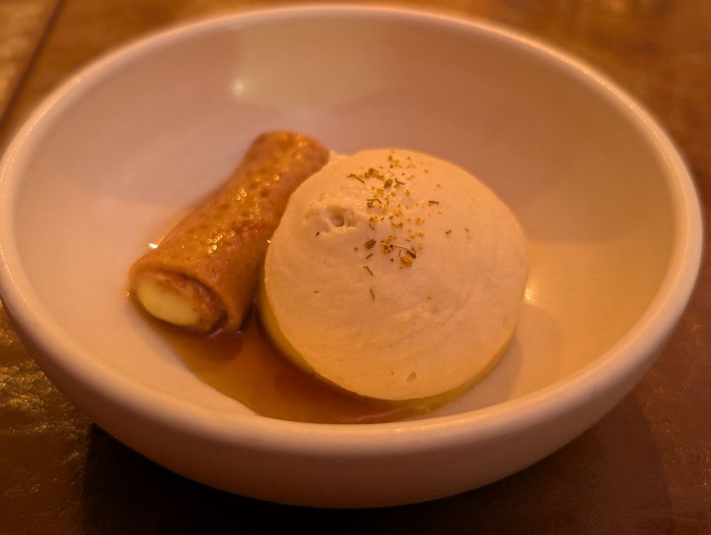 Paw paw cremeux with chamomile crème diplomat, a red fife wheat crèpe stuffed with ginger custard, and caramelized honey.