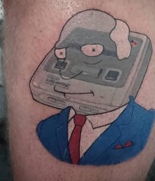 A tattoo of Superintendent Chalmers from the Simpsons merged with a super nintendo