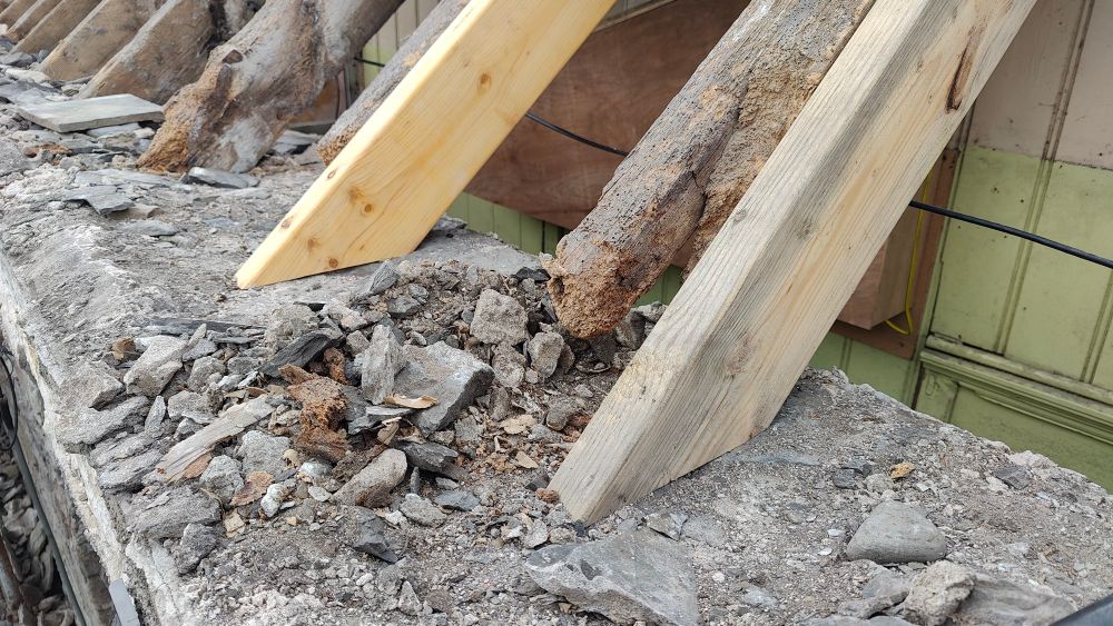 Roofing detail. New rafters bolted to the sides of old rafters who's feet have rotted.