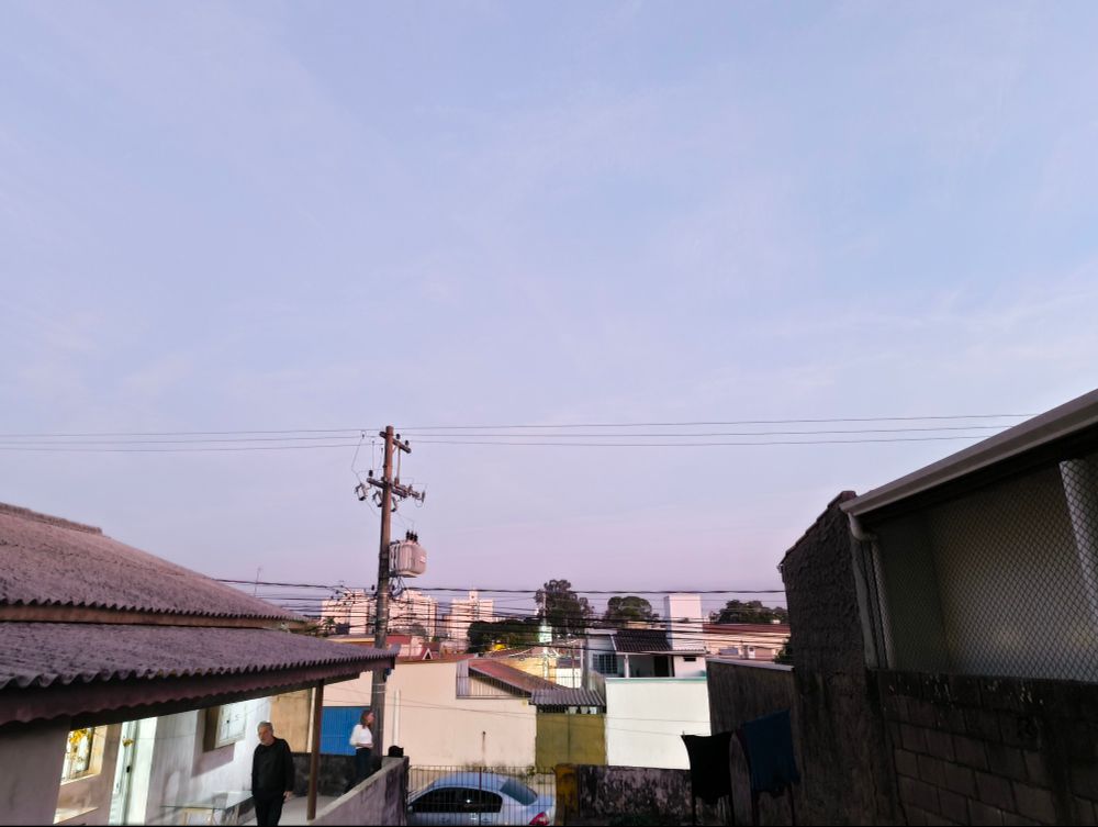 A picture the sky with some houses in the lower part of the photo