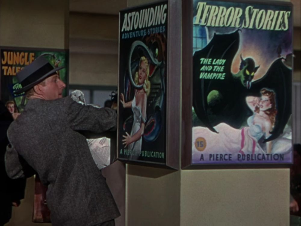 Danny Kay walks by posters depicting women being sexually menaced by a tentacle monster and a vampire in the 1947 movie, "The Secret Life of Walter Mitty."