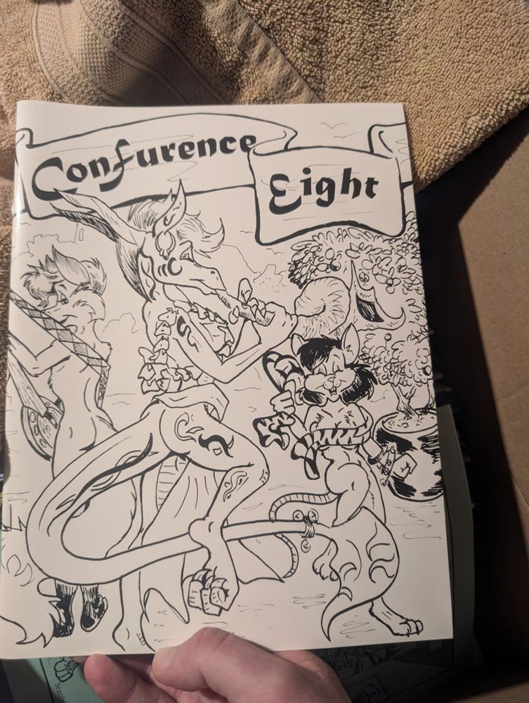 Front of a conbook for Confurence 8.