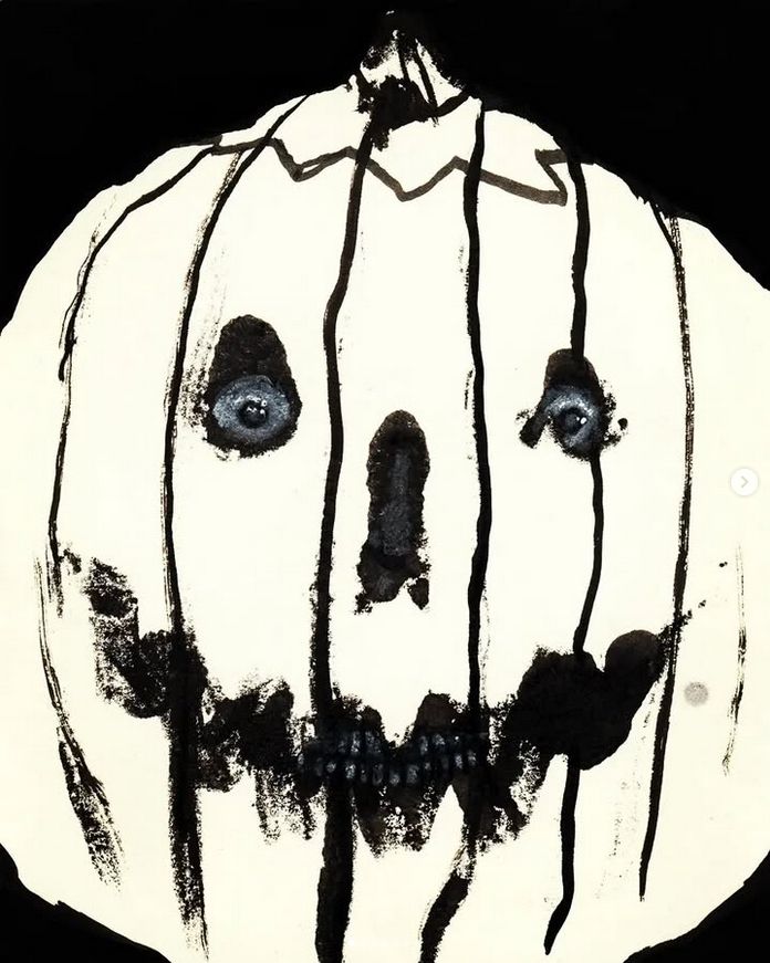 ink and white pencil jack-o-lantern with what looks an actual leering human head inside it, glaring at the viewer