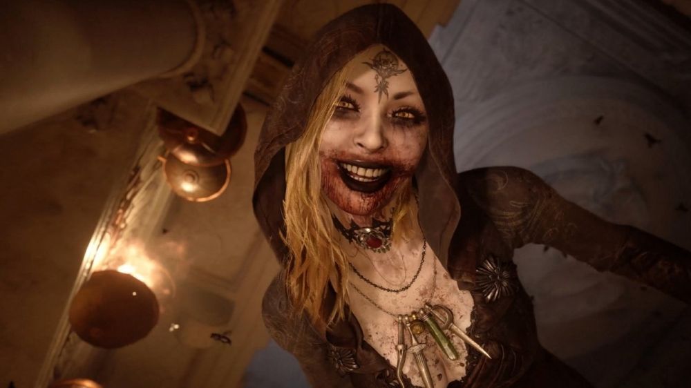 young(looking) Vampire/Witch lady smiling down at Ethan, blood smeared on her mouth