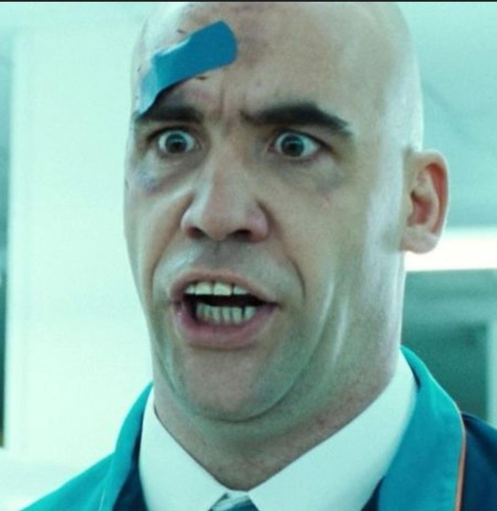 Screen frame of the trolley guy from Hot Fuzz mid yarp
