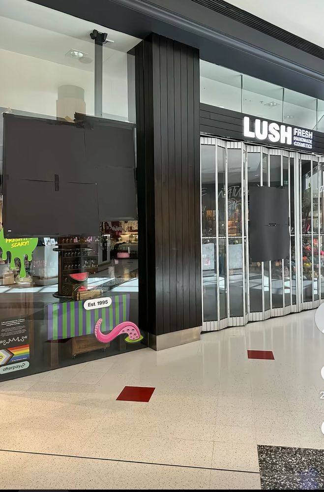Lush store with posters covered over