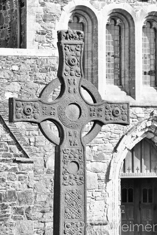 Black and white shot of a celtic cross at Iona Abbey