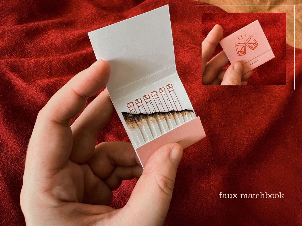 a faux matchbook, opened, to reveal several burned-down matches, revealing behind them an illustration of wolfwood's vials