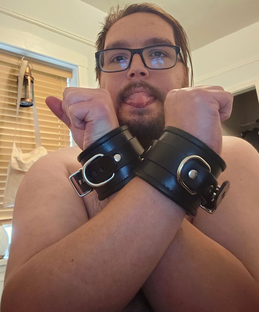 Face picture of me and my new leather wrist cuffs. 
