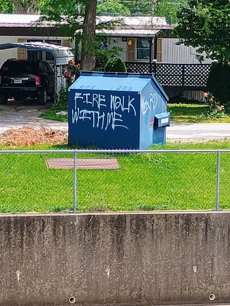 A dumpster tagged "Fire Walk With Me" in reference to the quintessential poem from Twin Peaks 