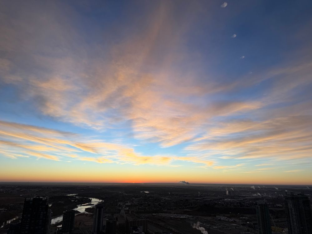 View east from The Bow at sunrise in Calgary, Alberta, Canada