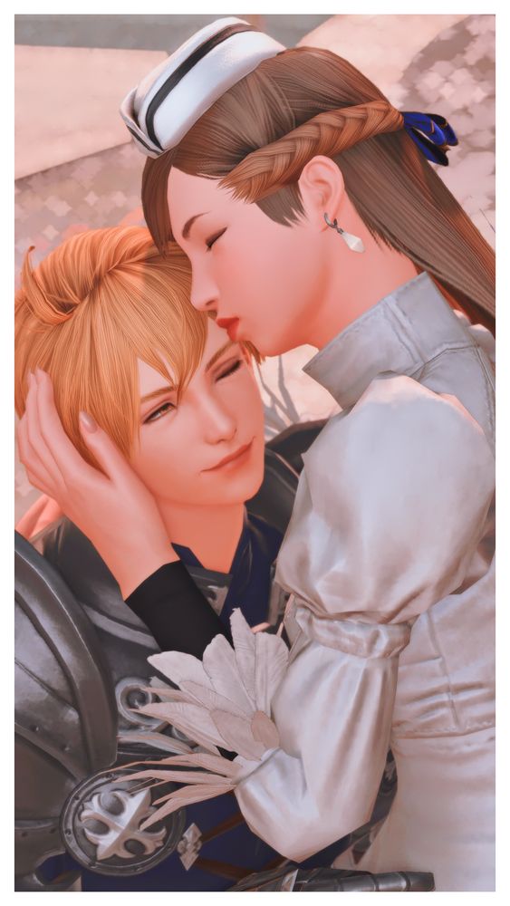 Ramza tilts his head back and leans into Cami as she plants a kiss on his forehead. She has one hand cupping his face and her other arm around his shoulder. This is a closeup.