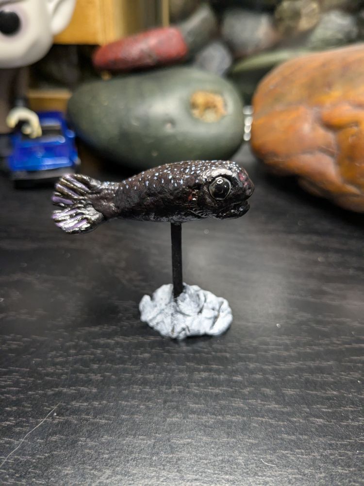 Little clay model of a male anglerfish