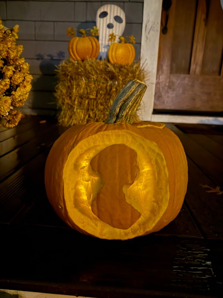 A large and beautiful pumpkin reverse carved with the silhouette of Jane Austen 