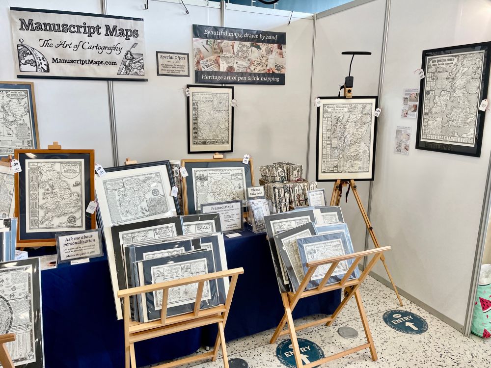 Manuscript Maps stall at Living North Live showing a variety of framed and map prints