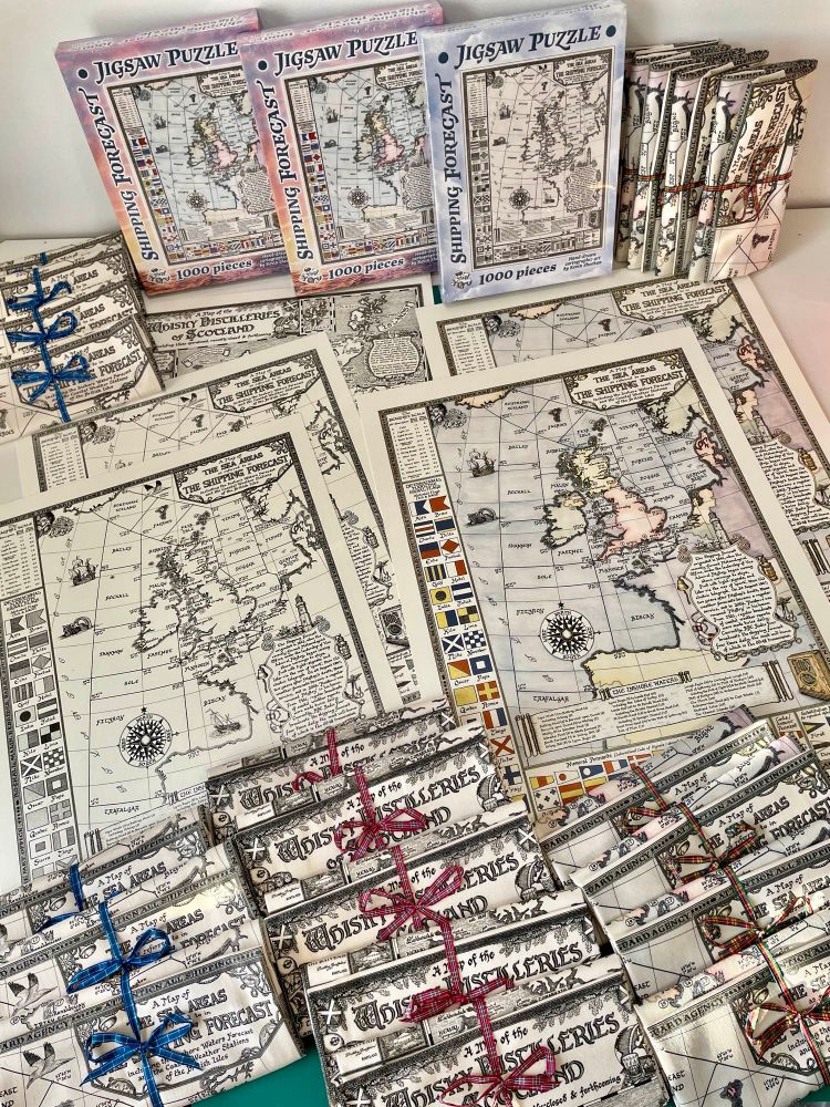 A selection of maps by Manuscript Maps, including puzzles, tea towels, and map prints.