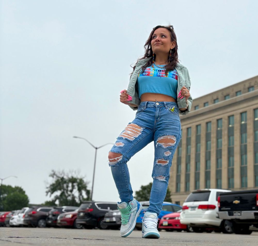 woman wear sneakers & a Julie Stauch For All Iowans shirt