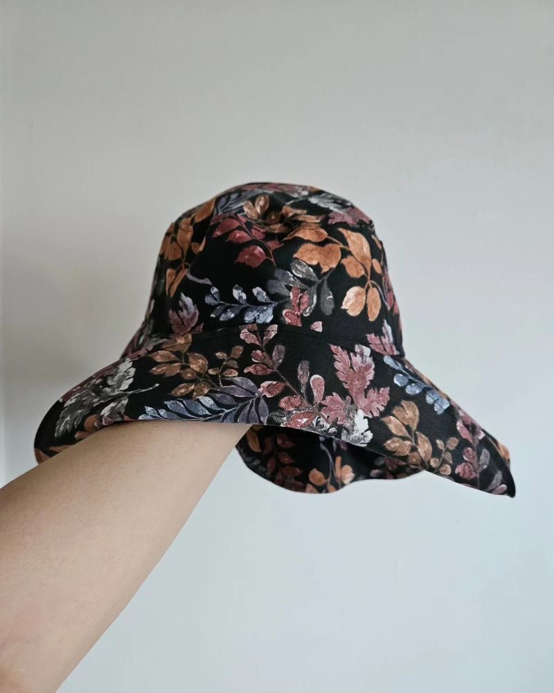 A floral print, handmade, reversible witch/bucket hat; bucket side.