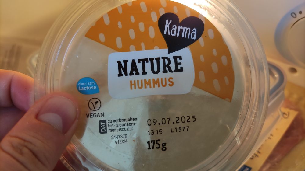 A picture of a bottle of hummus. It is labeled NATURE HUMMUS