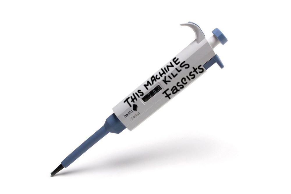 A lab pipette with THIS MACHINE KILLS FASCISTS written on it