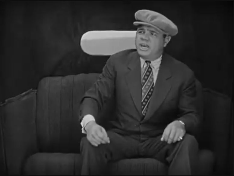 Another still from Speedy, showing Babe Ruth in the cab shouting at Lloyd's character to hurry up.