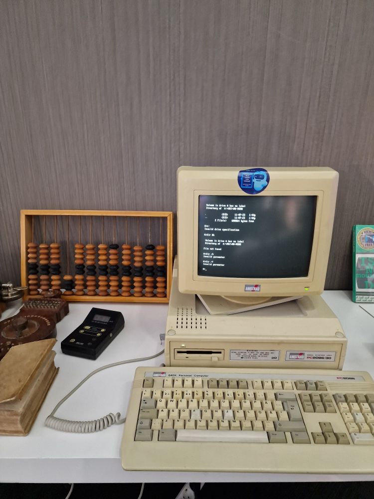 Old computer and abacus