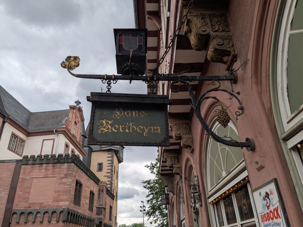 Looking up at the sign for Haus Wertheym in glorious old German font. More information about the building and the restaurant at: http://www.haus-wertheym.de/