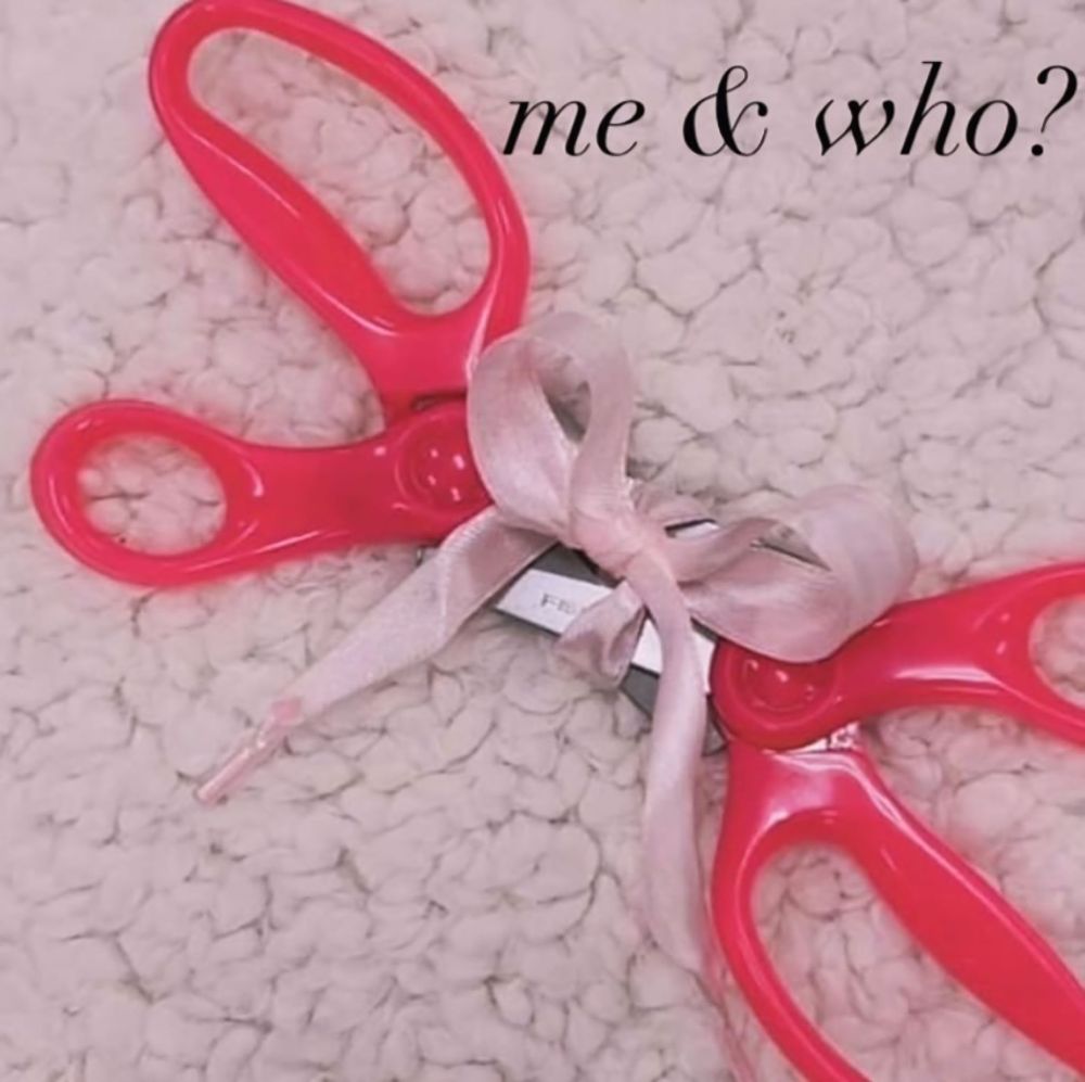 two pairs is scissors tied together with a pink bow in a compromising position. #meme #wlw