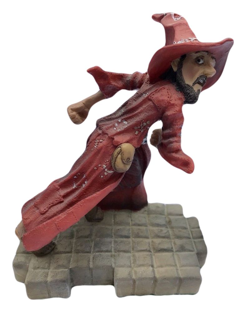 Clarecraft figurine of Rincewind, a scrawny wizard dressed in red robes and red hat, running away at speed. 