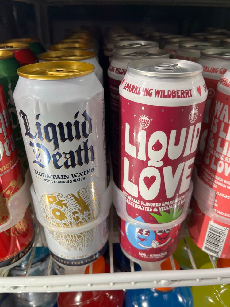 Two different canned water beverages called “Liquid Death” and “Liquid Love”