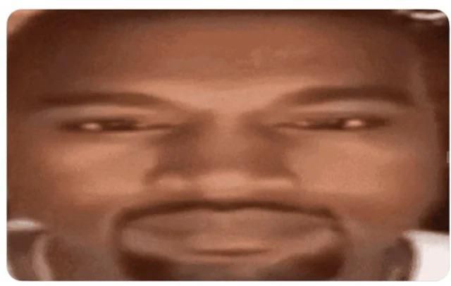 Kanye west with a deadpan stare to the camera