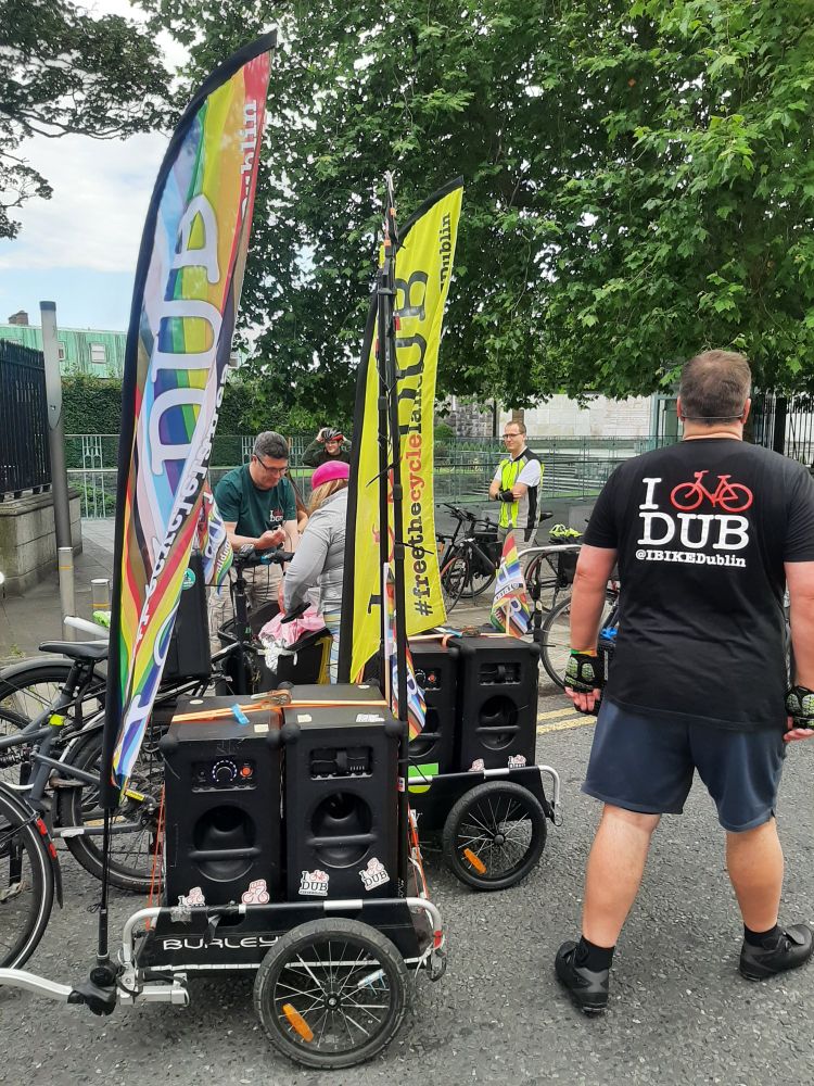 Cargo bike with speakers and Pride flags