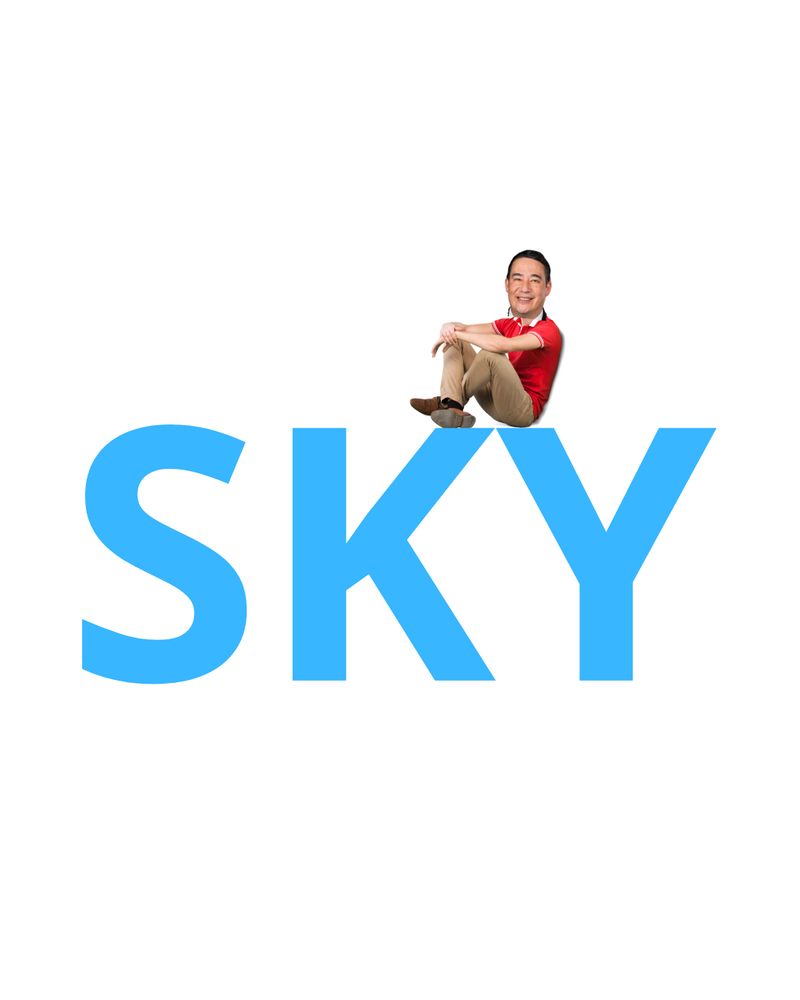 Secretary Hobbs is sitting on the large word "SKY" written in blue, smiling with his arms around his raised knees.
