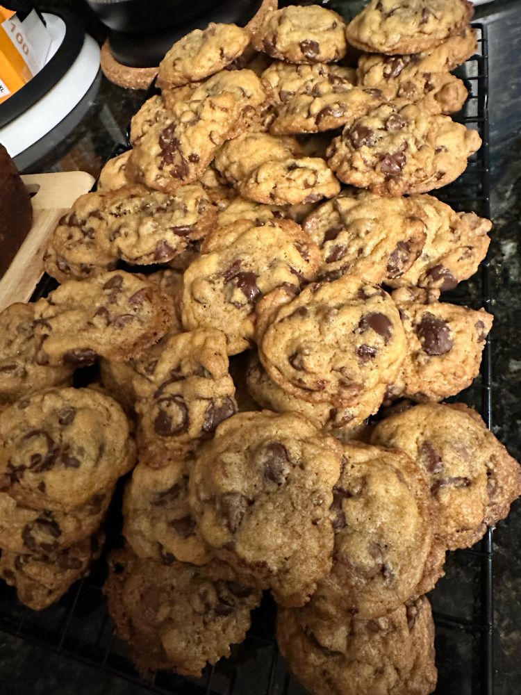 Triple chocolate chip cookies are on the cooking rack. Almost ready to eat. 