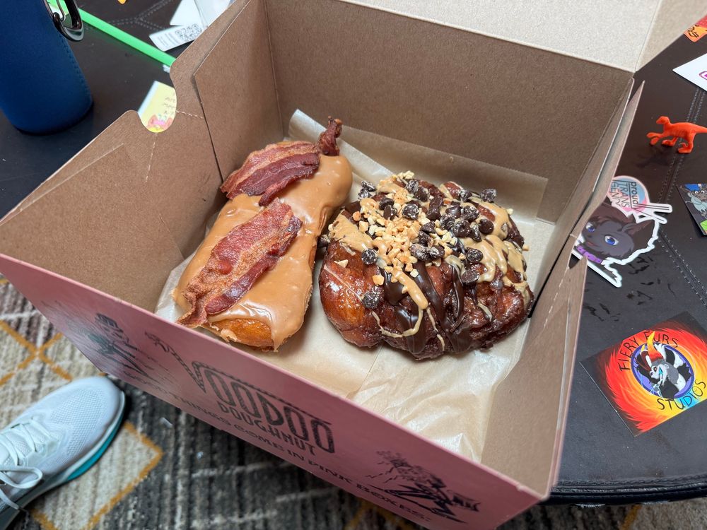 Picture of a box with two large donuts inside