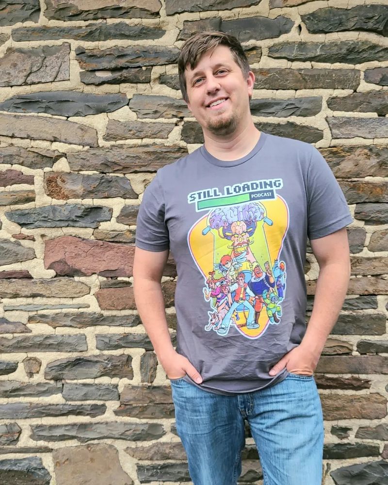 Me in a Captain N Still Loading Podcast shirt.