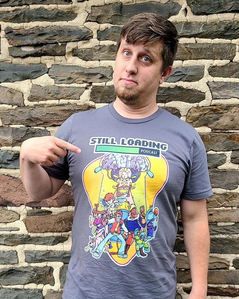 A closer shot of me in a Captain N Still Loading Podcast shirt.