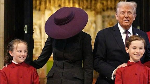 A photograph of Mrs Trump whose face is hidden behind a, frankly absurd, hat.
