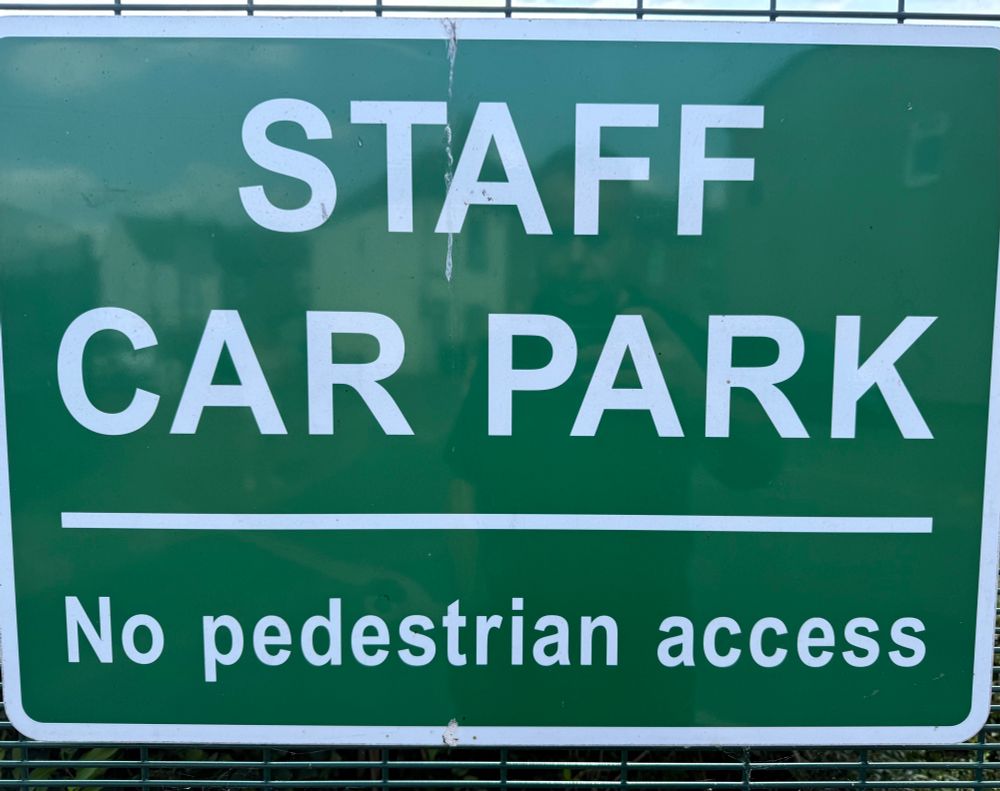 A sign which reads “Staff Car Park. No pedestrian access”.