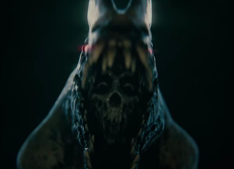 Screen cap of the jumpscare reveal from the upcoming game "Terrible Lizards" teaser trailer- which shows a human skull inside of a dinosaur's mouth.
