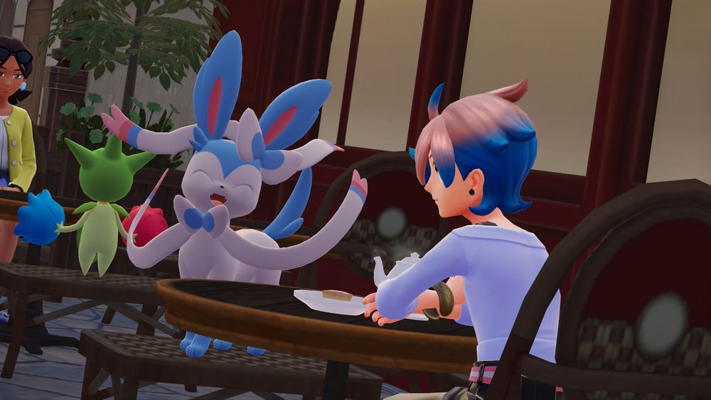 Pokemon Legends Z-A screenshot from the Switch 2 version. My trainer enjoying some tea at a cafe with their shiny Sylveon.