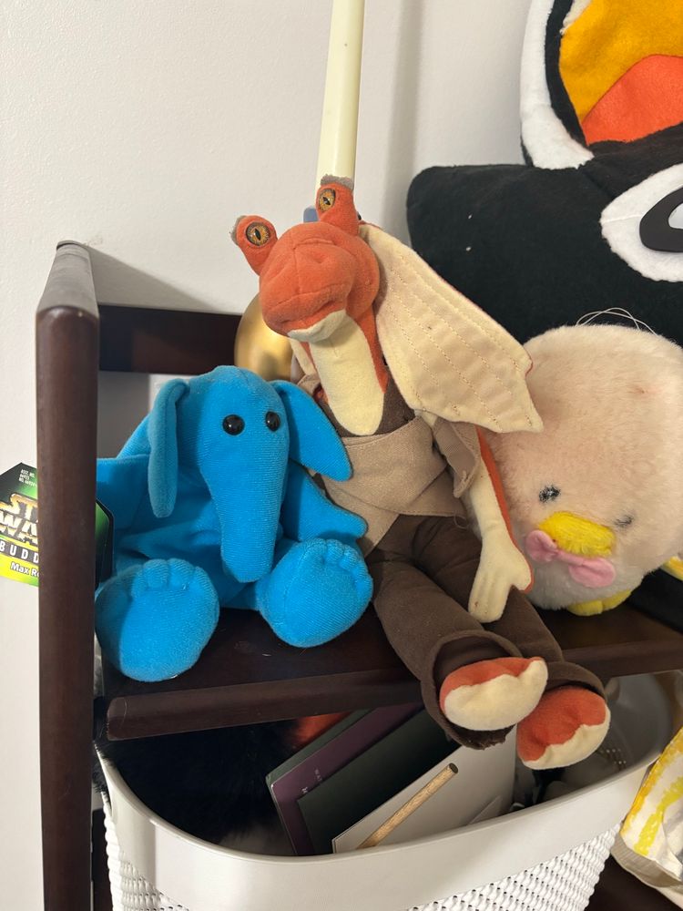 Jar jar at his new home, up on a shelf next to a max rebo plush